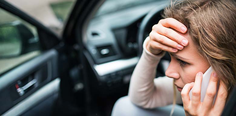 Woman frantic on the phone after car accident