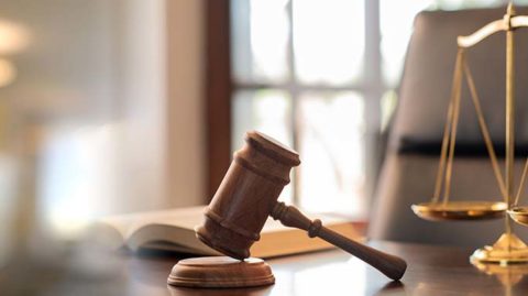 Gavel and scale on desk