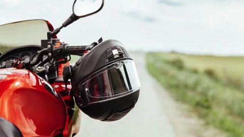 Motorcycle helmet on a red motorcycle