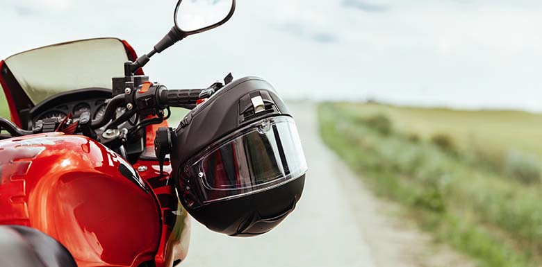 Motorcycle helmet on a red motorcycle